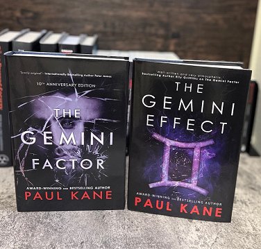 Display of two hardback books standing up. The Gemini Factor and The Gemini Effect by Paul Kane