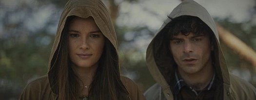 Still from the Colour of Madness - man and woman, hooded