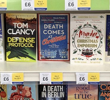 photograph showing a copy of Death Comes at Christmas, edited by Marie O'Regan and Paul Kane, on a shelf in a TESCO store