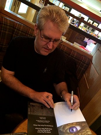 Paul Kane signing copies of The Disease