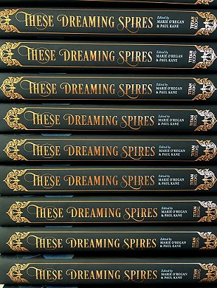 photograph of a stack of copies of These Dreaming Spires, edited by Marie O'Regan and Paul Kane, showing the books' spines