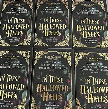 A display of six copies of In These Hallowed Halls, edited by Marie O'Regan and Paul Kane