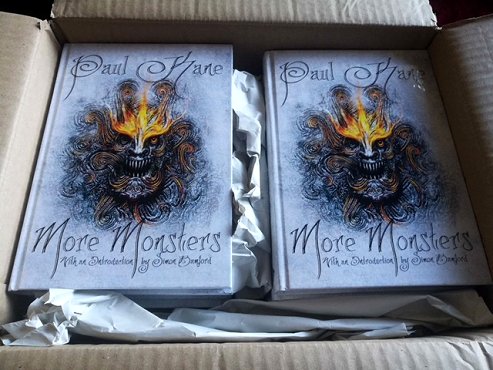 Box full of copies of More Monsters by Paul Kane