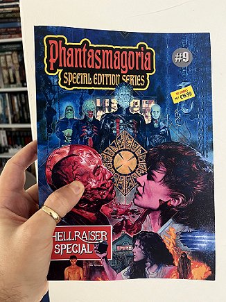 image of a man's hand holding a copy of a magazine, the Phantasmagoria Hellraiser special