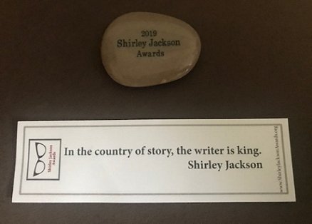 2019 Shirley Jackson Awards nominee pebble and bookmark with quotation - In the country of Story, the writer is king