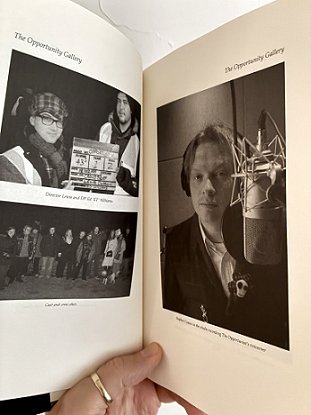 photogpaph showing a man's hand holding a copy of Short Sharp Shocks by Paul Kane, open to show some illustrations from The Opportunity