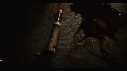 Still from The Torturer, instrument on worktop, bloodstains