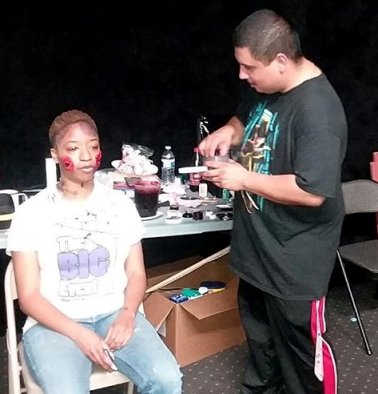 Makeup artist, woman being made up