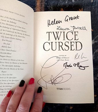 Title interior page of Twice Cursed, edited by Marie O'Regan and Paul Kane, featuring signatures of the editors and also Helen Grant, Laura Purcell and Joanne Harris