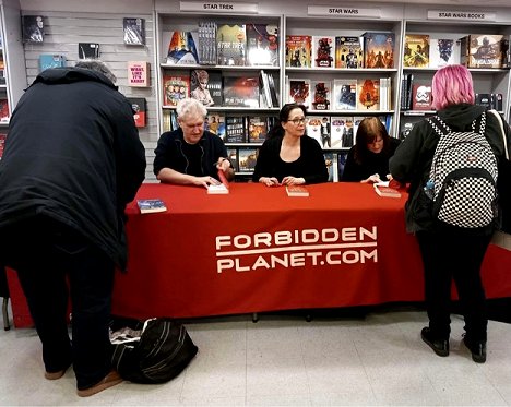 Paul Kane, Helen Grant and Marie O'Regan signing copies of Twice Cursed