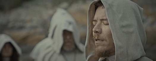 Still from the Colour of Madness - hooded man