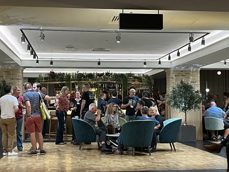 photograph of a busy bar at FantasyCon 2023