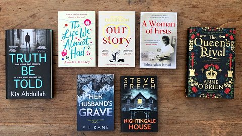 Book display, including Her Husband's Grave, by P L Kane