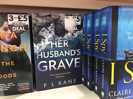 Bookshelf in The Works, featuring Her Husband's Grave by P L Kane