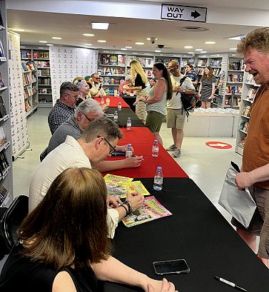 Authors signing. From front: Marie O'Regan, Cavan Scott, Paul Finch, Guy Adams, Alexandra Benedict, Laura Mauro