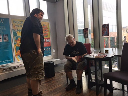 Paul Kane signing copies of Sherlock Holmes and the Servants of Hell, Liverpool One